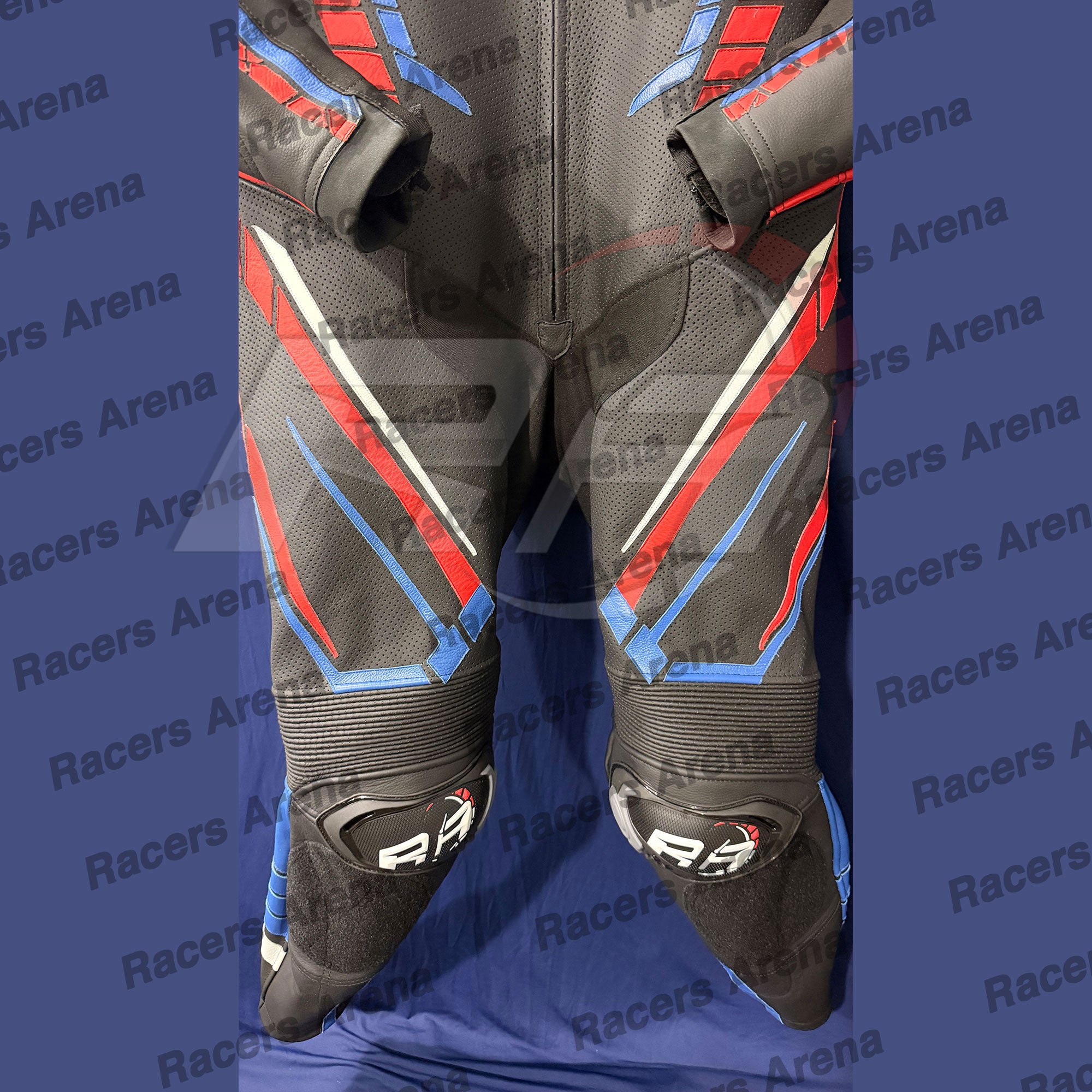 Black leather motorcycle racing suit with red and blue geometric accents, displayed flat against a blue background with a repeating 'Racers Arena' watermark.